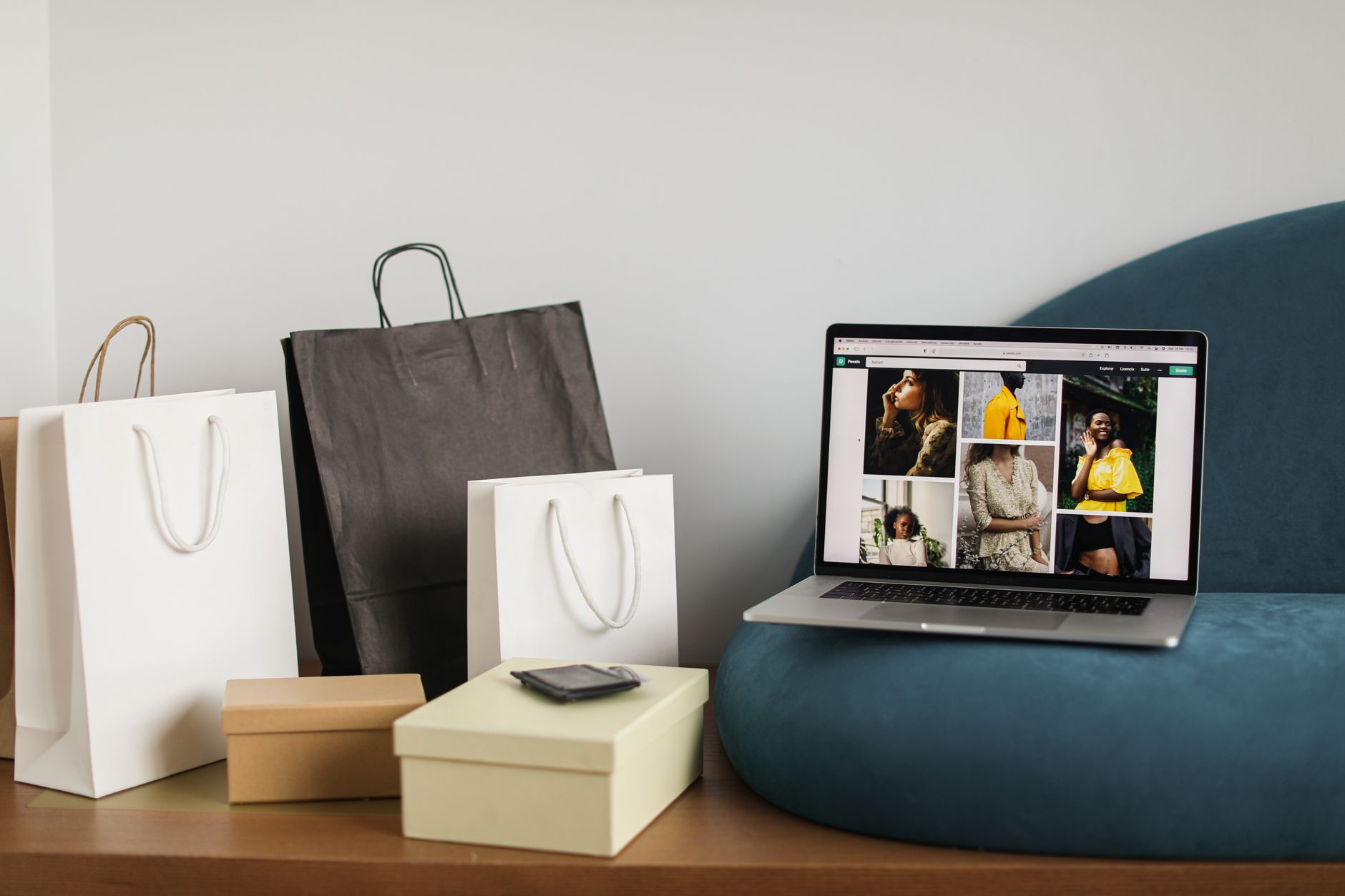 Laptop displaying a fashion e-commerce website